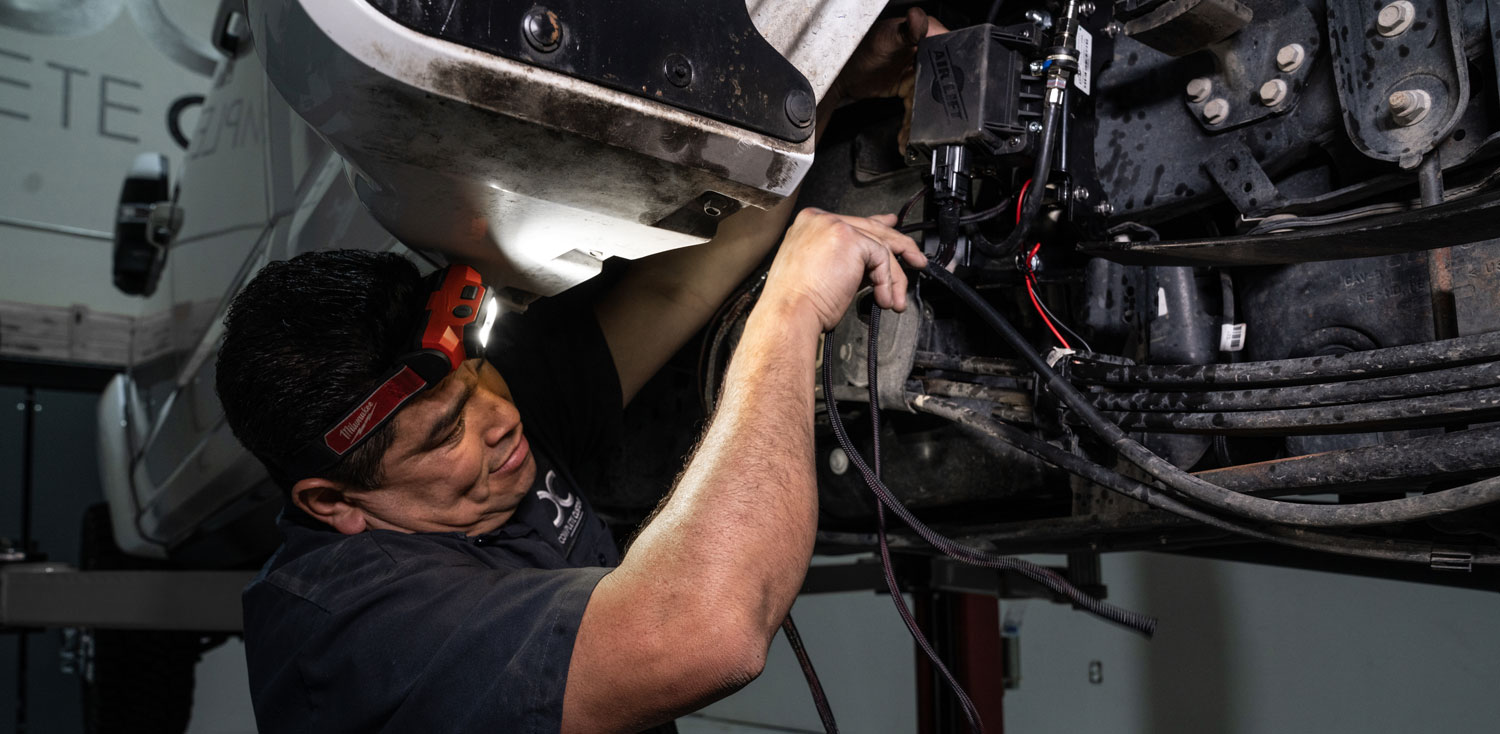 Installer working on air spring kit