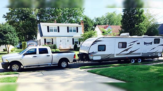 Truck with Air Lift suspension hauling camper.